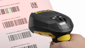 Cognex fixed barcode reader reads through stretch wrap to improve barcode scanning.